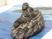 Vintage WE The Wolf Sculptures Eskimo in Canoe OR Eskimo Man and