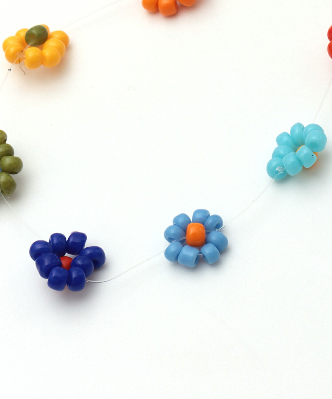 楽天市場】スレッドフロルブレスレット ／ カラフル ビーズ ゴム 腕輪