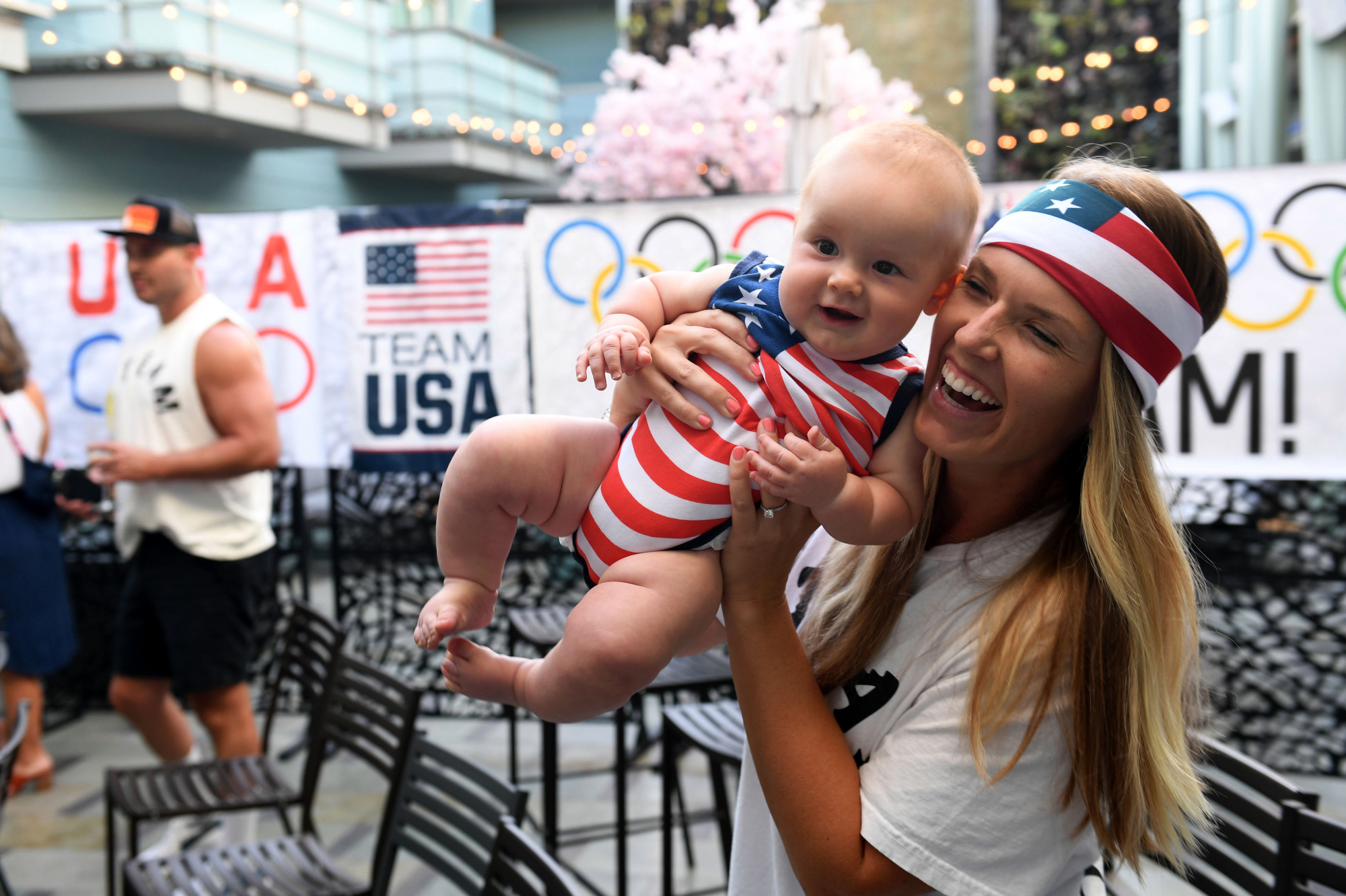 Family, friends cheer for golden Olympic beach volleyball pair at