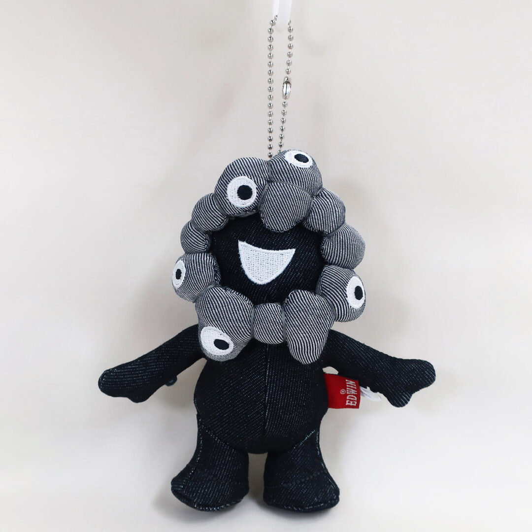 大阪・関西万博公式キャラクター「ミャクミャク」と老舗デニムブランド