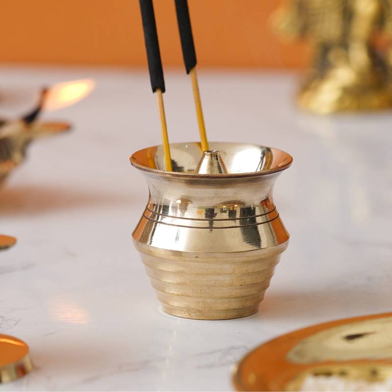 One golden matka shape brass incense stick holder agarbatti stand
