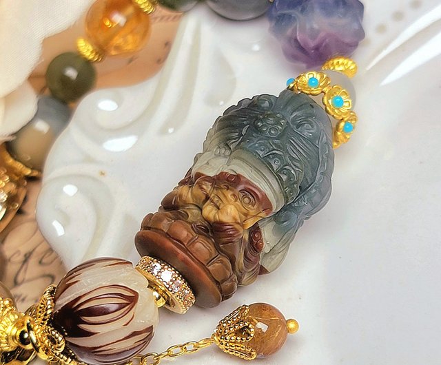 台湾 チベットの女神「ザキ・ラモ」。仮面を手に、色とりどりの