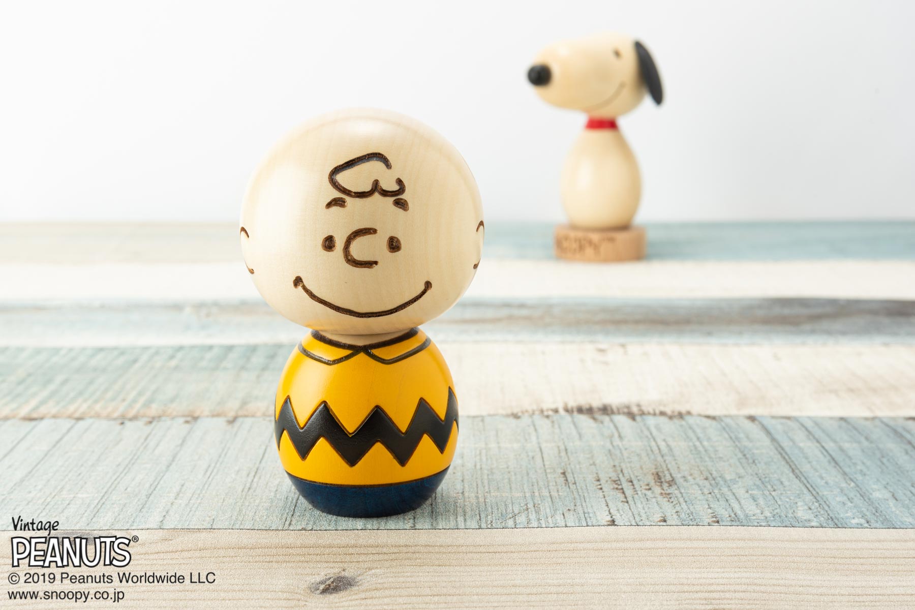 群馬県の伝統工芸「創作こけし」より「スマイル」をテーマに作り上げた