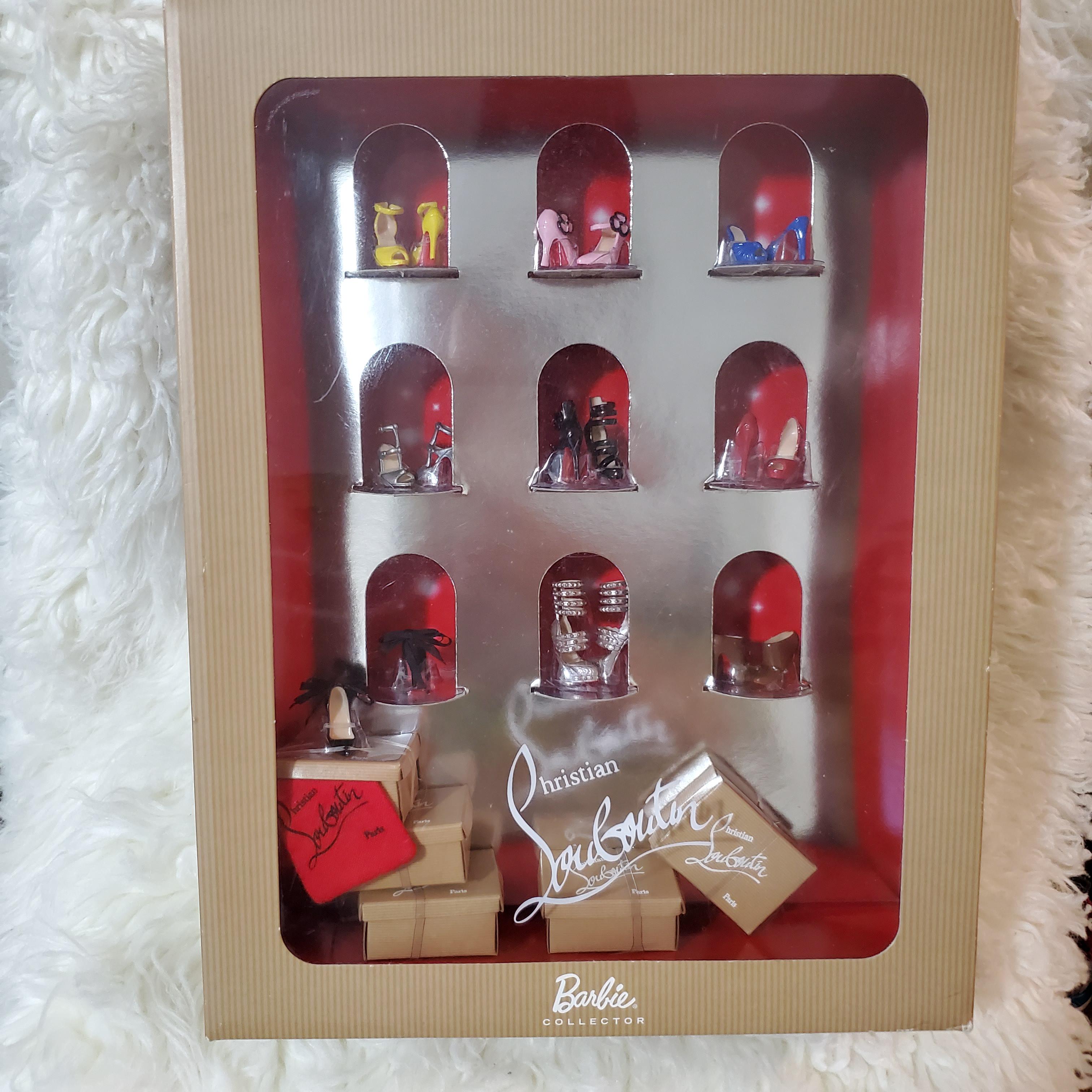 Barbie Christian Louboutin heels. It comes with shoe boxes and a