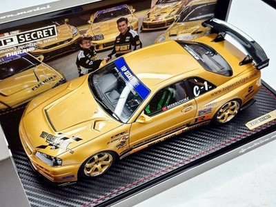 IG3799 – 1/18 TOP SECRET 34GT-R (BNR34) Gold Comes with RB26