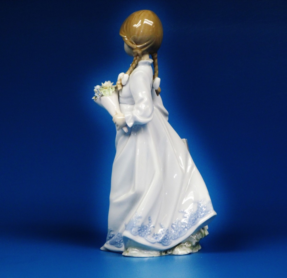Lladro Porcelain Figurine # 7604 School Days” Girl with Flowers.by