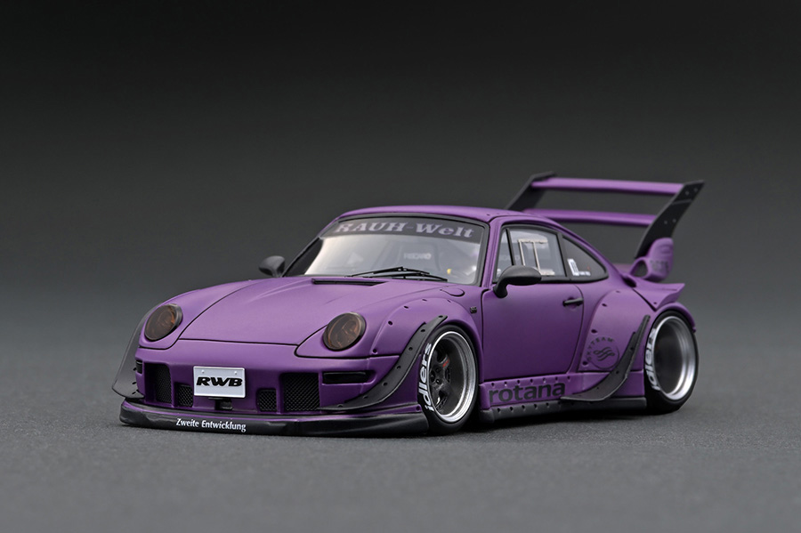 IG2322 1/43 RWB 993 Matte Purple With Mr. Nakai sitting on sofa