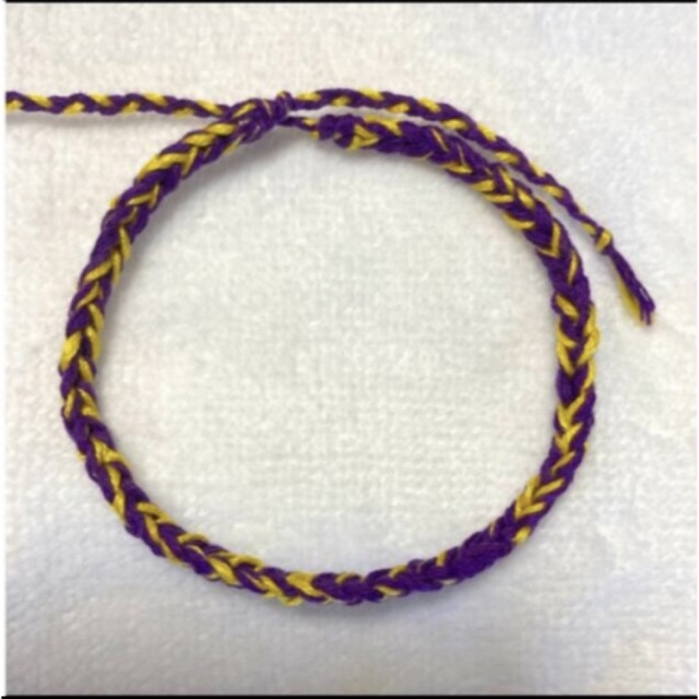 ミサンガ ブレスレット アンクレット ハンドメイド 紫 黄色の通販 by