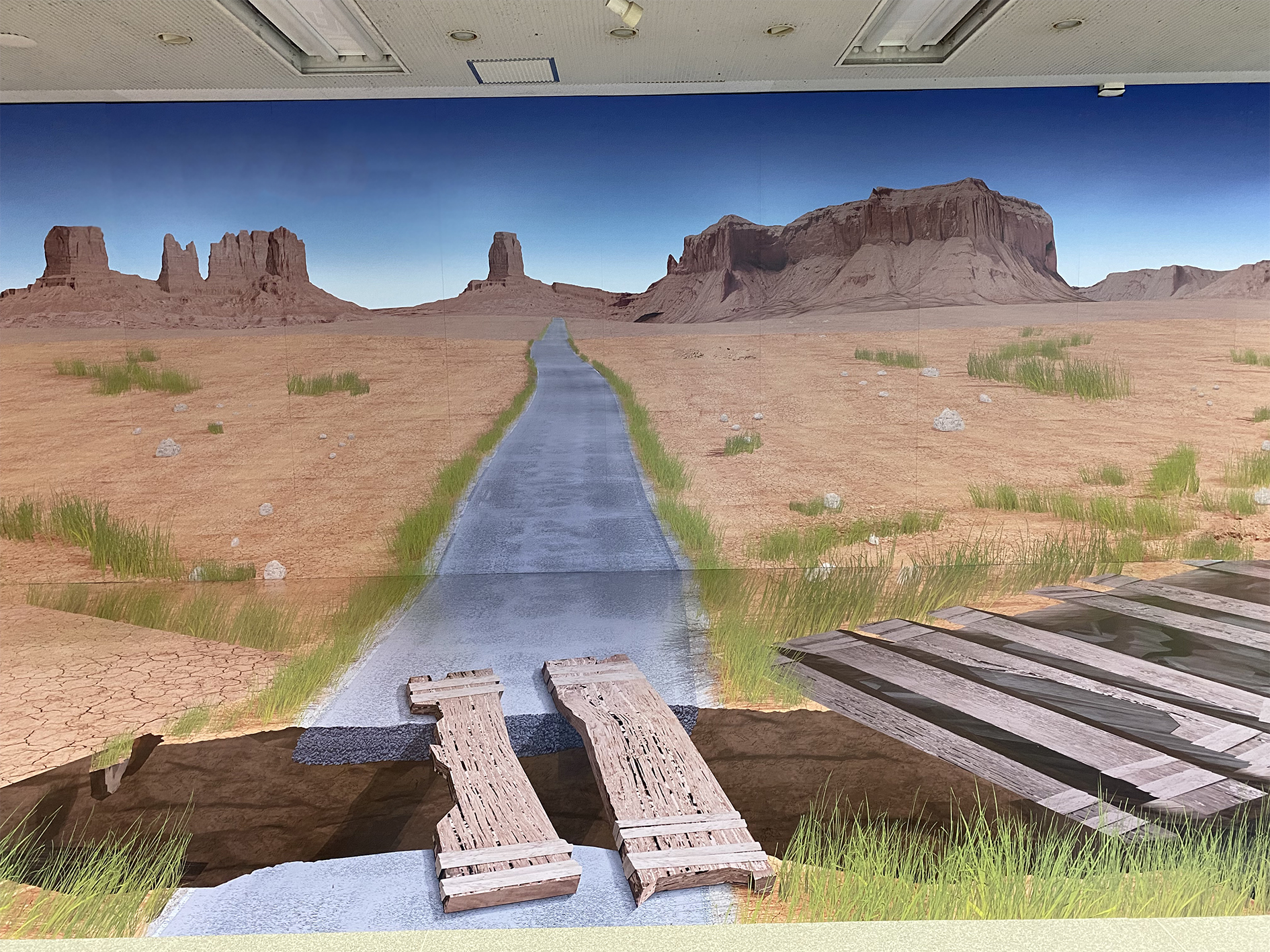 3Dアート(トリックアート)で工場のエントランスが荒野に変身