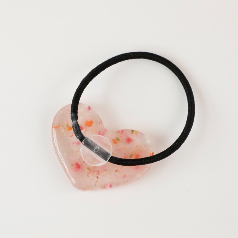 レジン ハートのヘアゴム by ナナイロリボン |「障がい者福祉」を買物