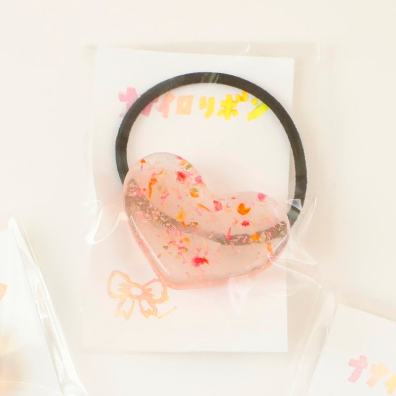 レジン ハートのヘアゴム by ナナイロリボン |「障がい者福祉」を買物