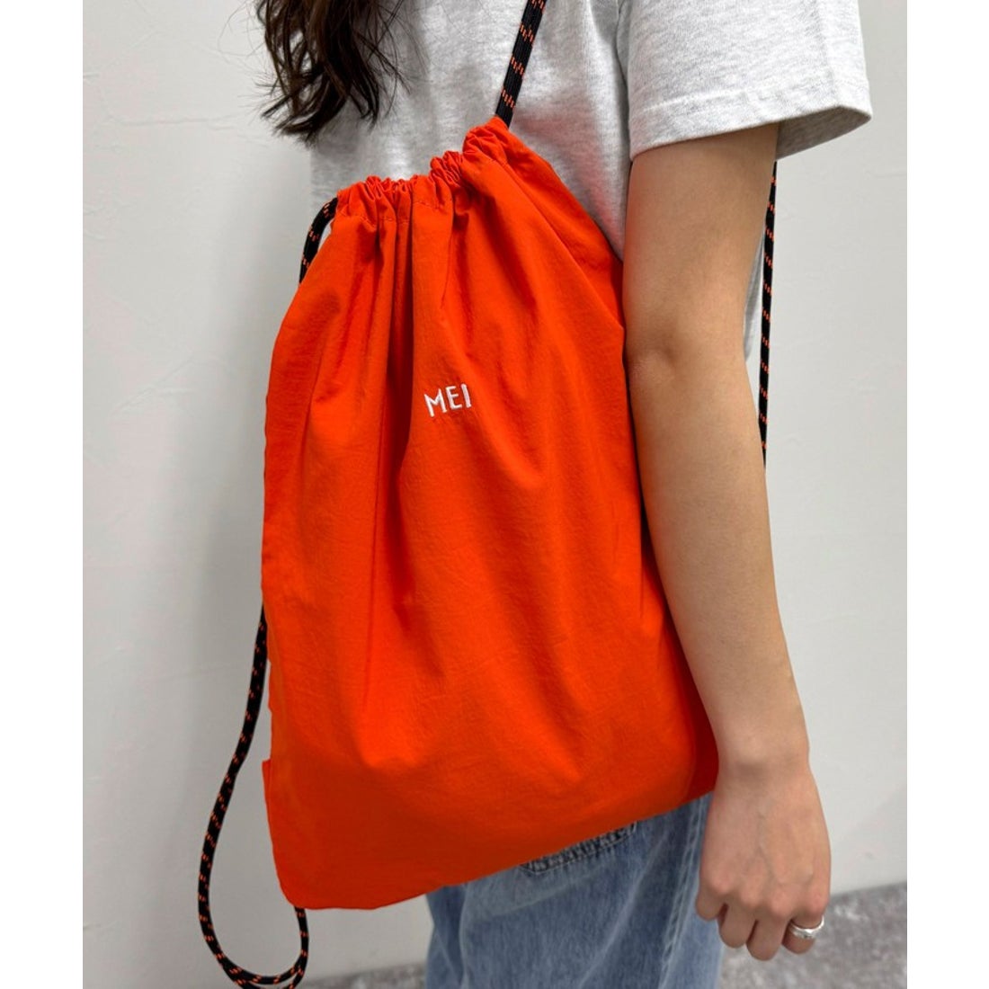 フレディエミュ fredy emue MEI ショルダー付ナップサック （オレンジ