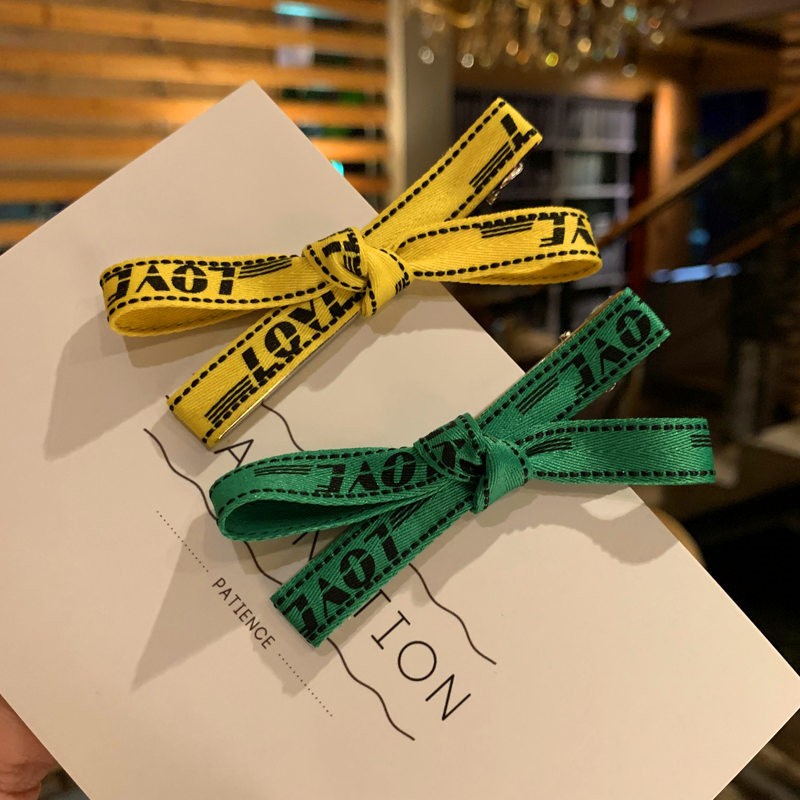 送料無料 テープ リボン ヘアクリップロゴ 文字入り 赤 黄色 クリップ