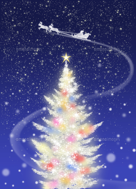 色々な色に光る白いクリスマスツリーとソリに乗るサンタクロース