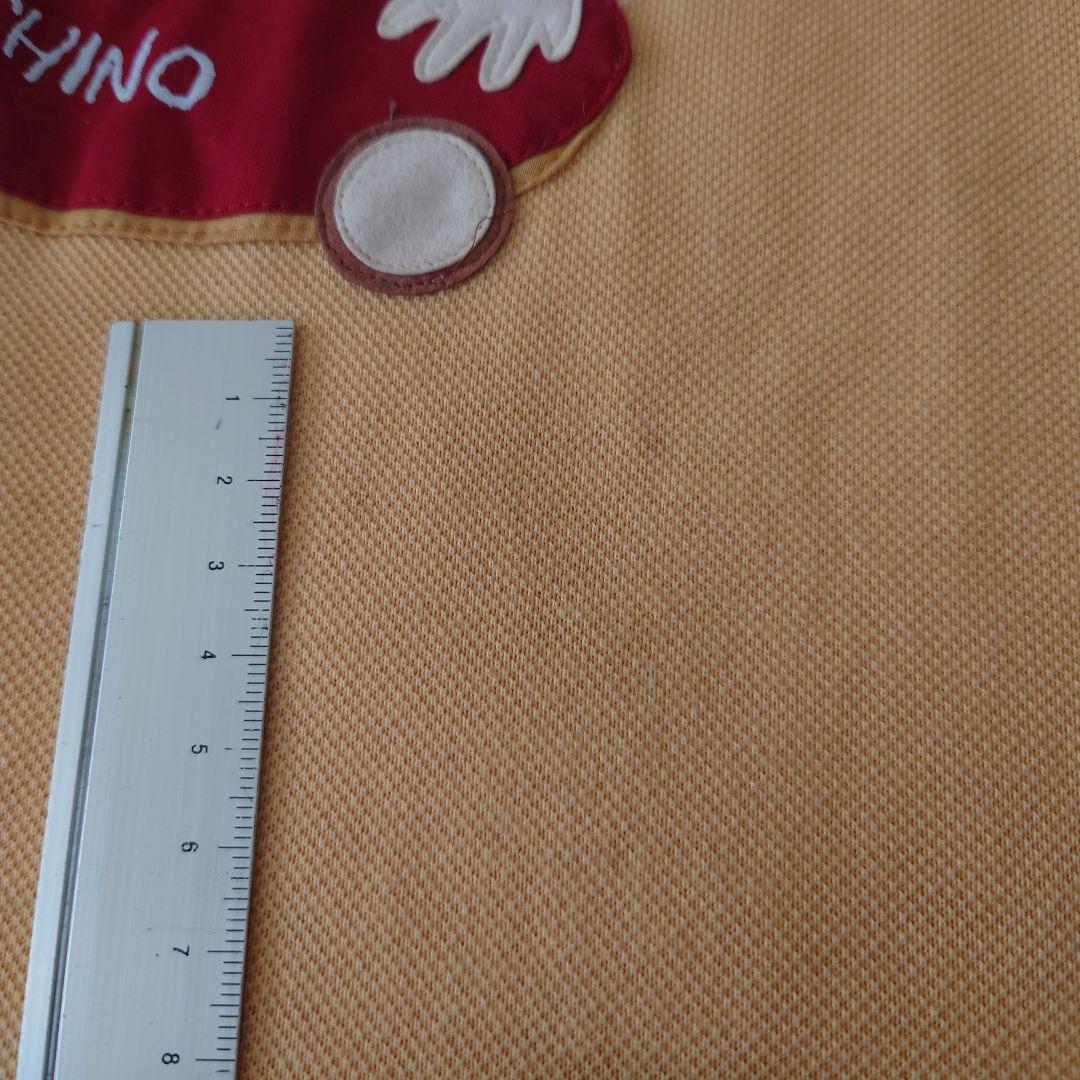 POTECHINO キャラクター付きエプロン オレンジ さえら - メルカリ