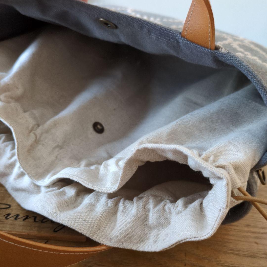 【1572】あおりポケットの巾着バッグ＊ミナペルホネン