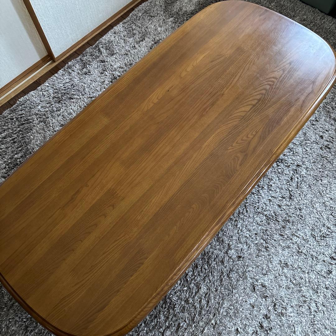 値下げしています！木製楕円形リビングローテーブル 下部棚付き