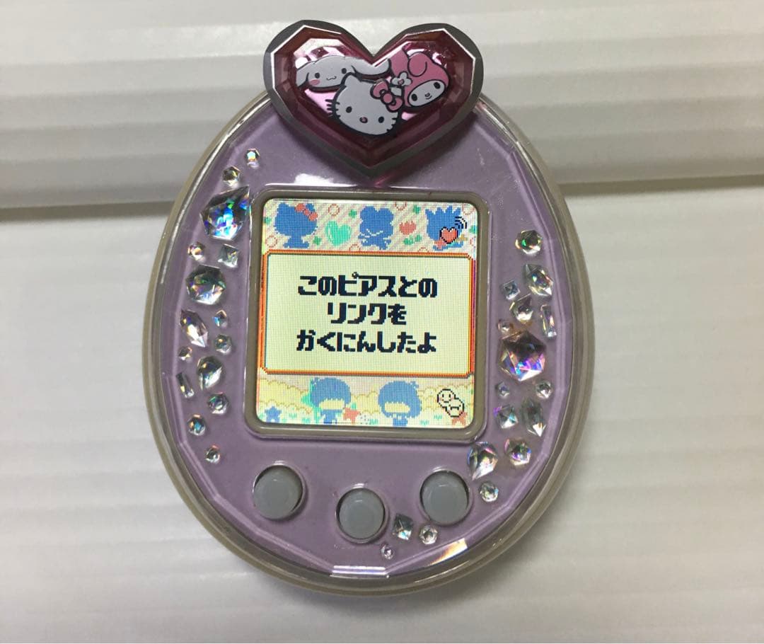 たまごっちp's ピース たまデコピアス サンリオ 手帳2枚付き - メルカリ