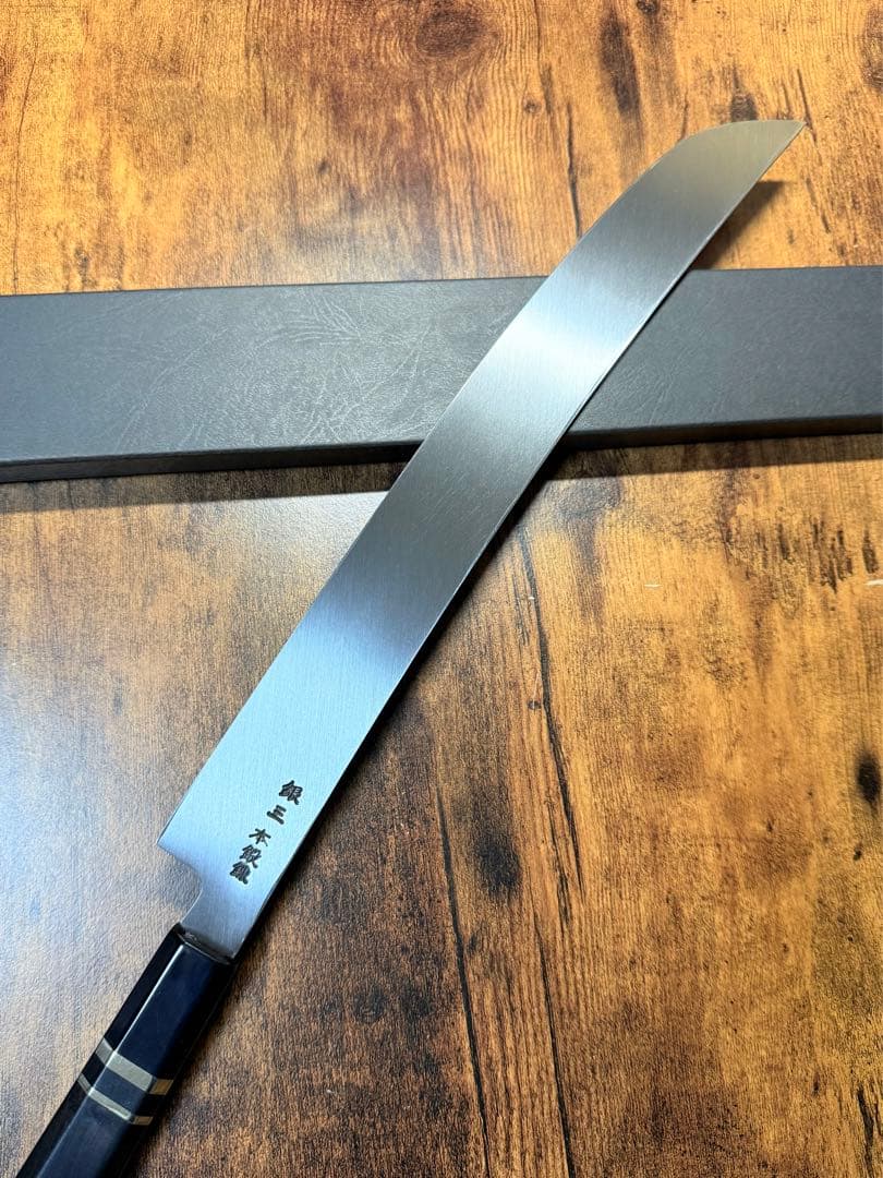 【堺打刃物】祥太郎作　蛸引 先丸　包丁　尺一　銀三鋼　鬼反り黒檀銀巻八角水牛柄