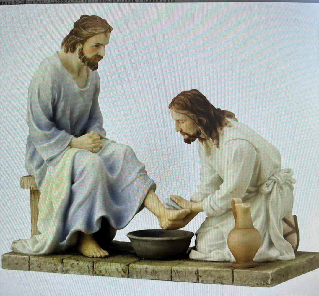 洗足の場面の宗教的彫刻