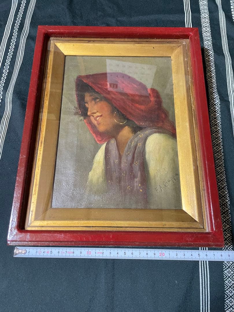 赤いフレームの人物画 FANGU