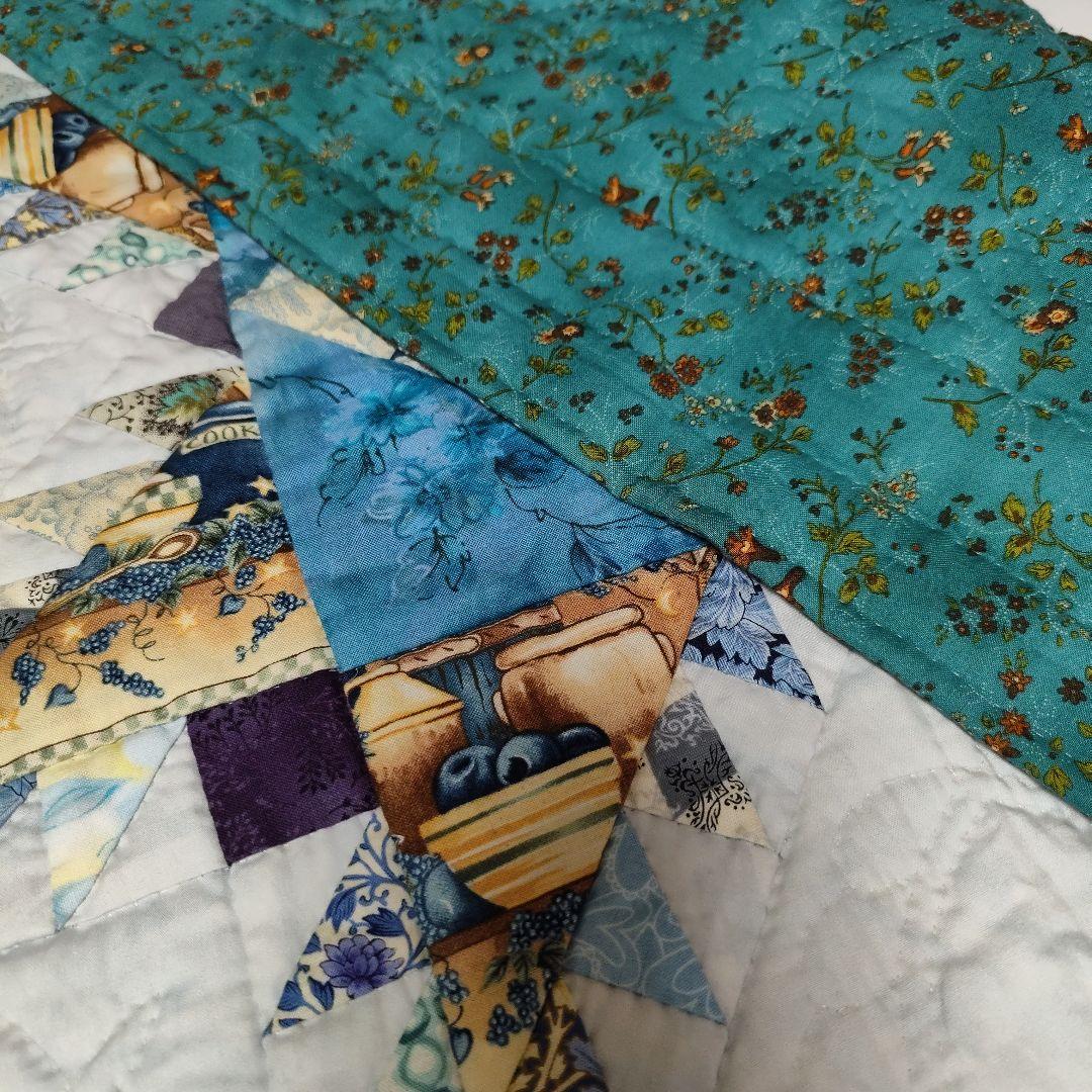 手縫いフェザースターのタペストリー