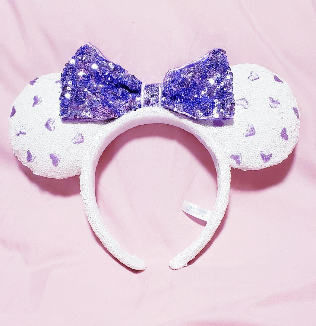 新品】ディズニー カチューシャ デイジー紫 白ハート スパンコール