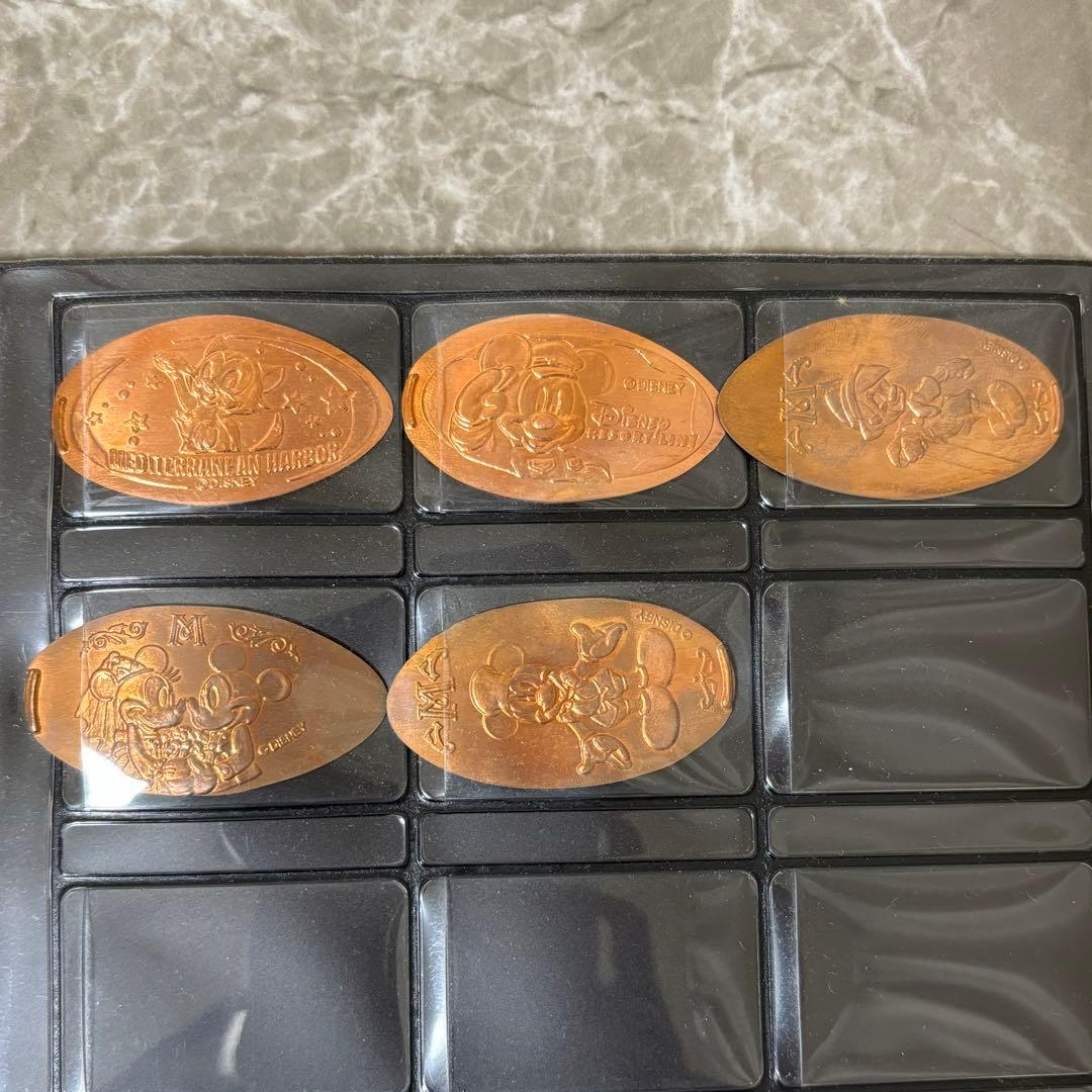 ディズニー メダルブック スーベニアメダル - メルカリ