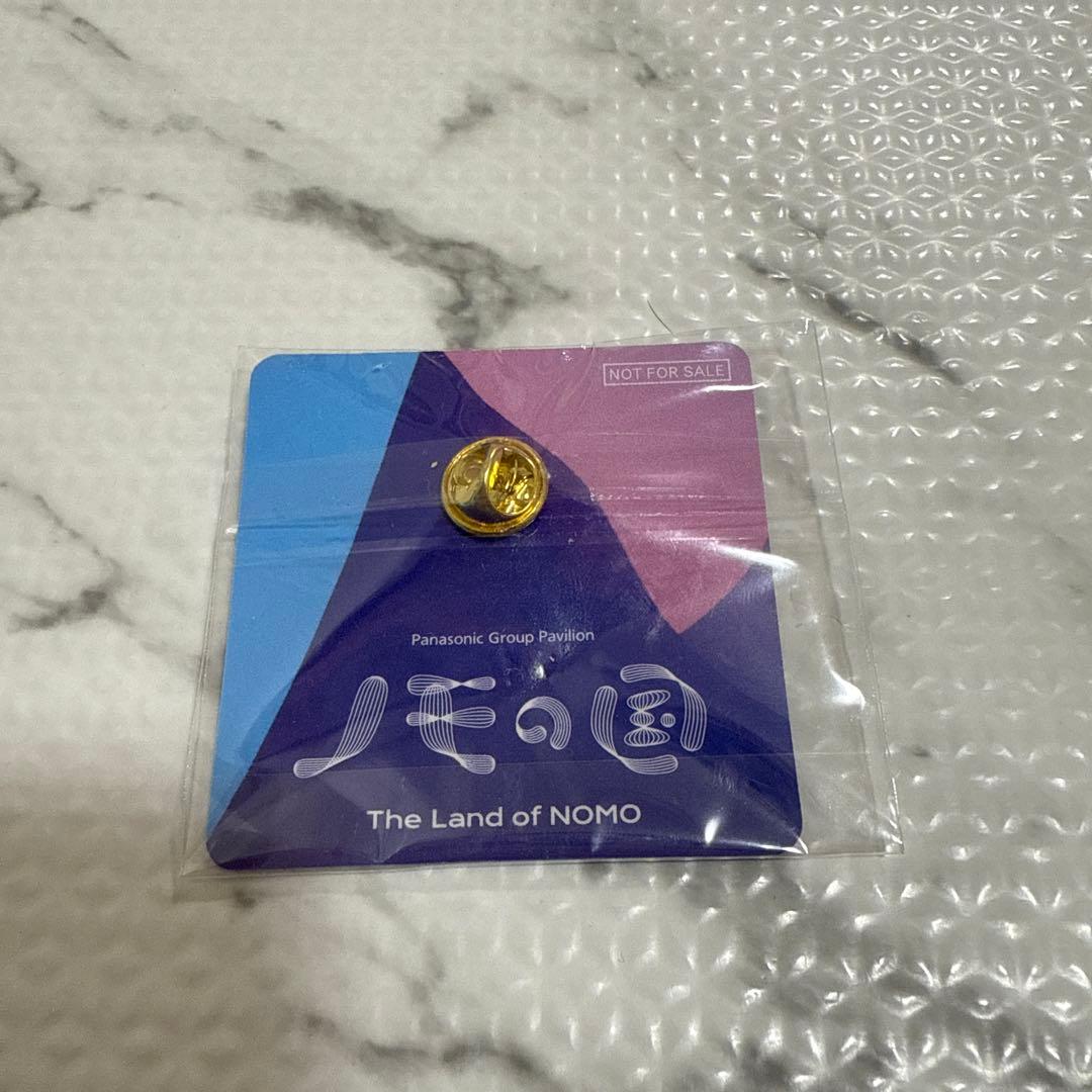 非売品》パナソニックパビリオン 万博 ノモの国 ピンバッジ - メルカリ